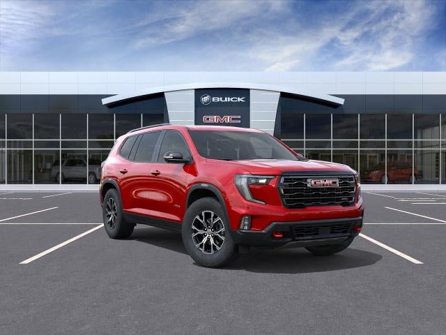 2026 GMC Acadia AT4 in Volcanic Red Tintcoat — front three-quarter view