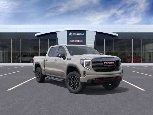 2026 GMC Sierra 1500 AT4 in Coastal Dune — front three-quarter view